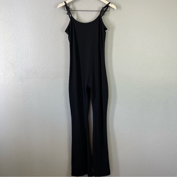 Aritzia TNAction Flare Black Super Soft Sporty Jumpsuit size medium - Picture 2 of 6